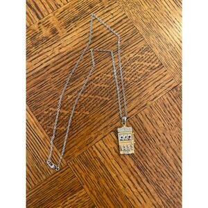 Costume jewelry gambling charm gold town, and silver tone necklace